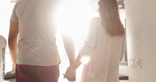 Young Mixed Race Couple Apartment Big Window Morning Sunlight, Cute Happy Hispanic Man Asian Woman Holding Hands Slow Motion