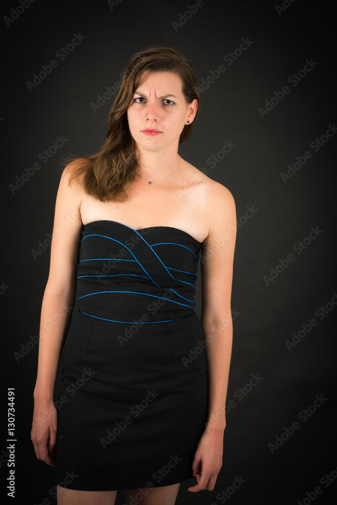 Beautiful woman doing different expressions in different sets of clothes: angry