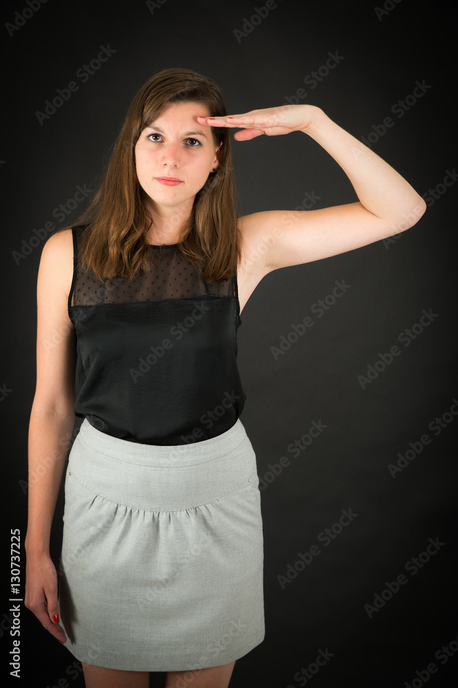 Beautiful woman doing different expressions in different sets of clothes: at attention Beautiful woman doing different expressions in different sets of clothes: at attention