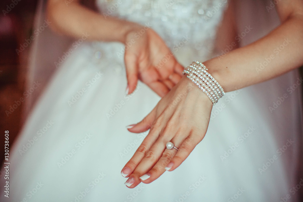 beautiful bracelet with diamonds and pearls on the hand of the b beautiful bracelet with diamonds and pearls on the hand of the b