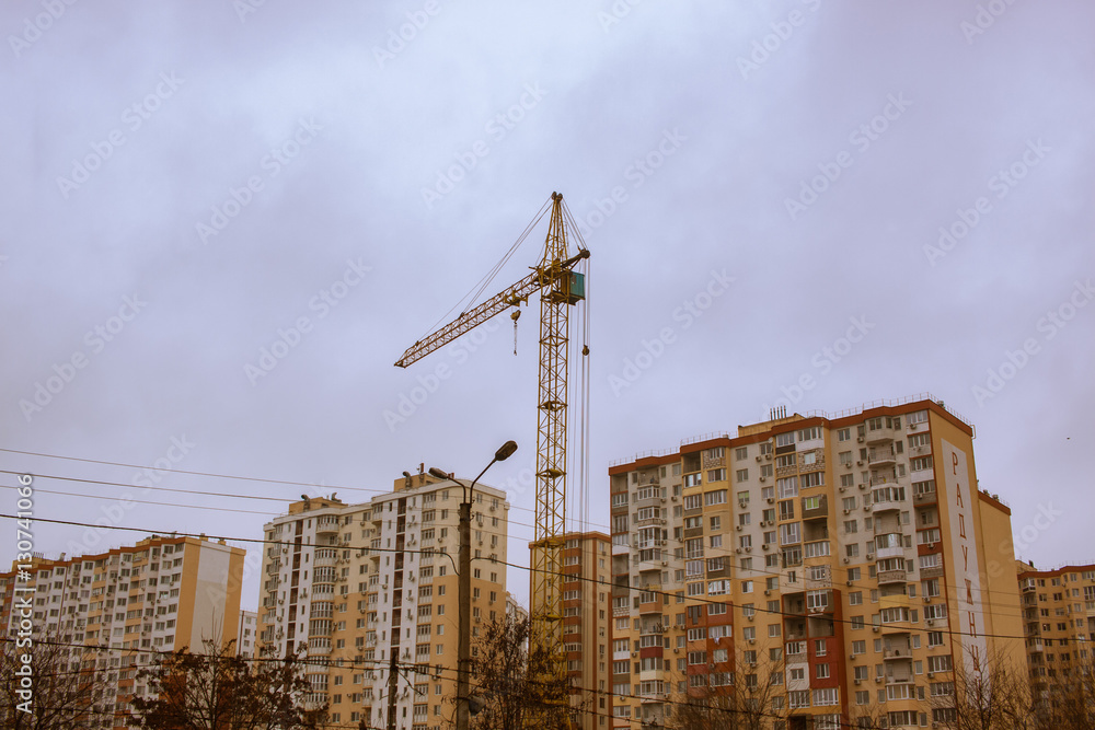 close up picture of building in progress with tower cranes