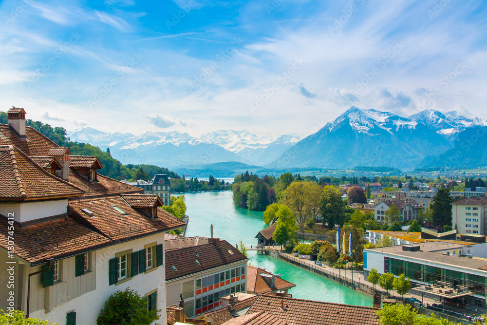 Landscape along lake Thun, Switzerland with view of Thun city an Landscape along lake Thun, Switzerland with view of Thun city an