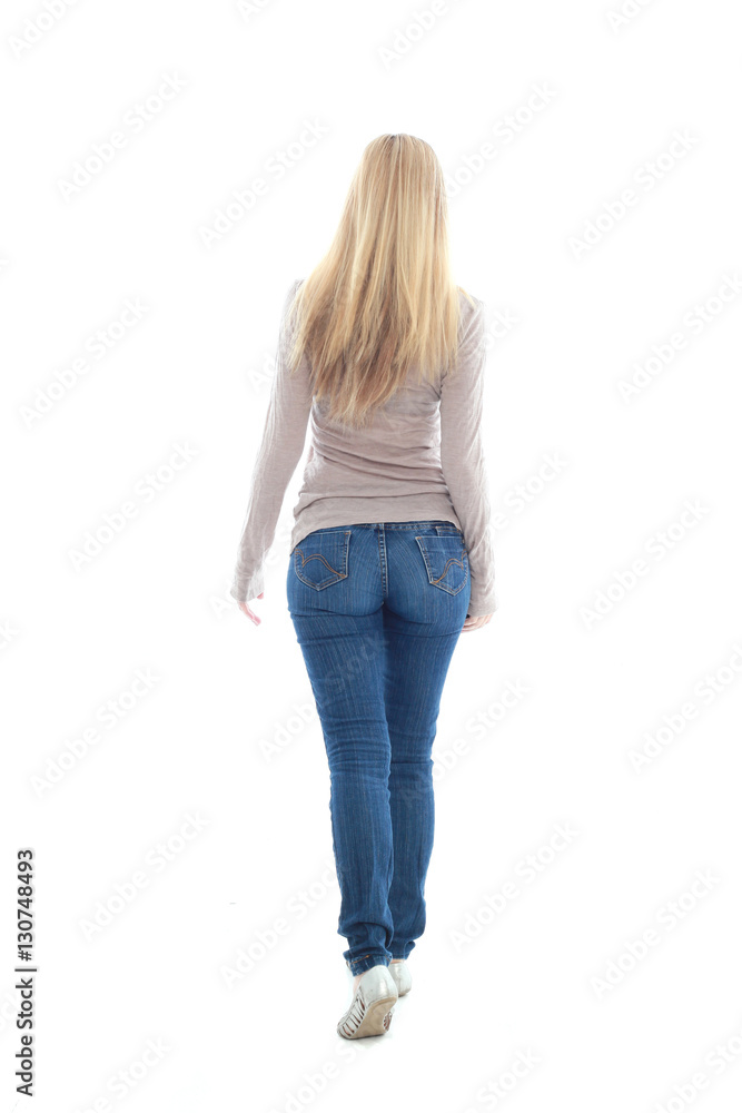 full length portrait of pretty blonde girl wearing casual brown shirt and jeans. standing pose isolated against white background full length portrait of pretty blonde girl wearing casual brown shirt and jeans. standing pose isolated against white background