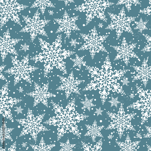 Seamless winter background of openwork snowflakes. Pattern.