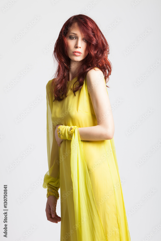 red-haired girl in long elegant yellow dress red-haired girl in long elegant yellow dress
