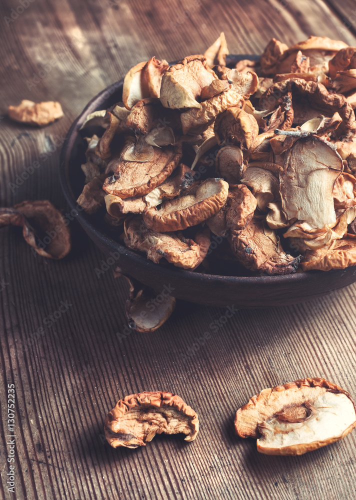 Full bowl od dried apple on the wooden table. Rustic style Full bowl od dried apple on the wooden table. Rustic style