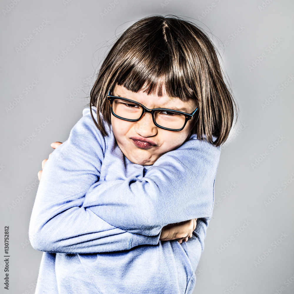 pouting girl having mad tantrum, crossing her arms for disagreement