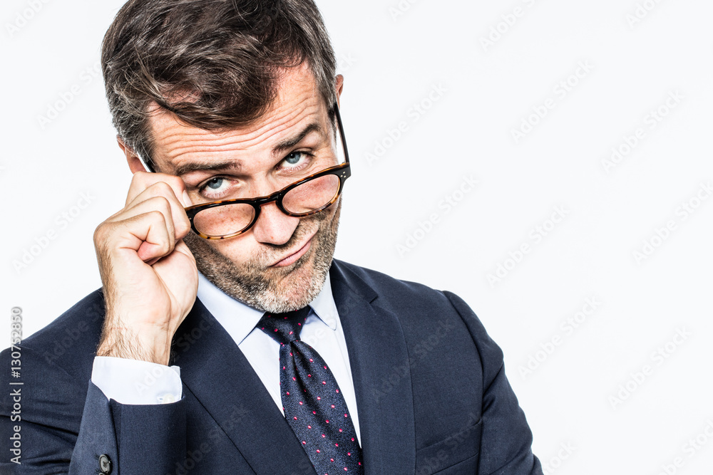 pouting far-sighted elegant businessman moving eyeglasses down for disappointment pouting far-sighted elegant businessman moving eyeglasses down for disappointment