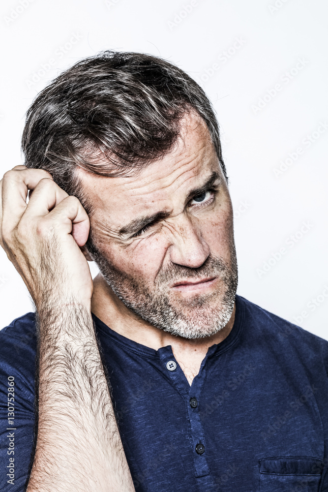 skeptical middle aged bearded man scratching his head for reflection skeptical middle aged bearded man scratching his head for reflection