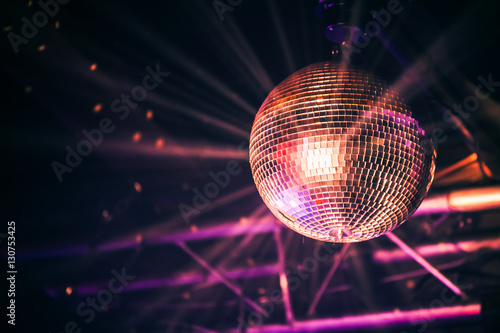 Disco ball with bright rays, night party