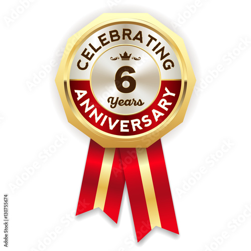 Red celebrating 6 years badge, rosette with gold border and ribbon