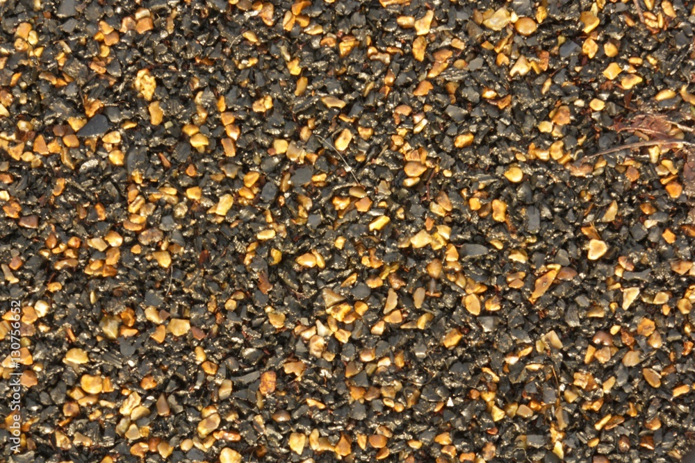 asphalt texture background with black and orange grains asphalt texture background with black and orange grains