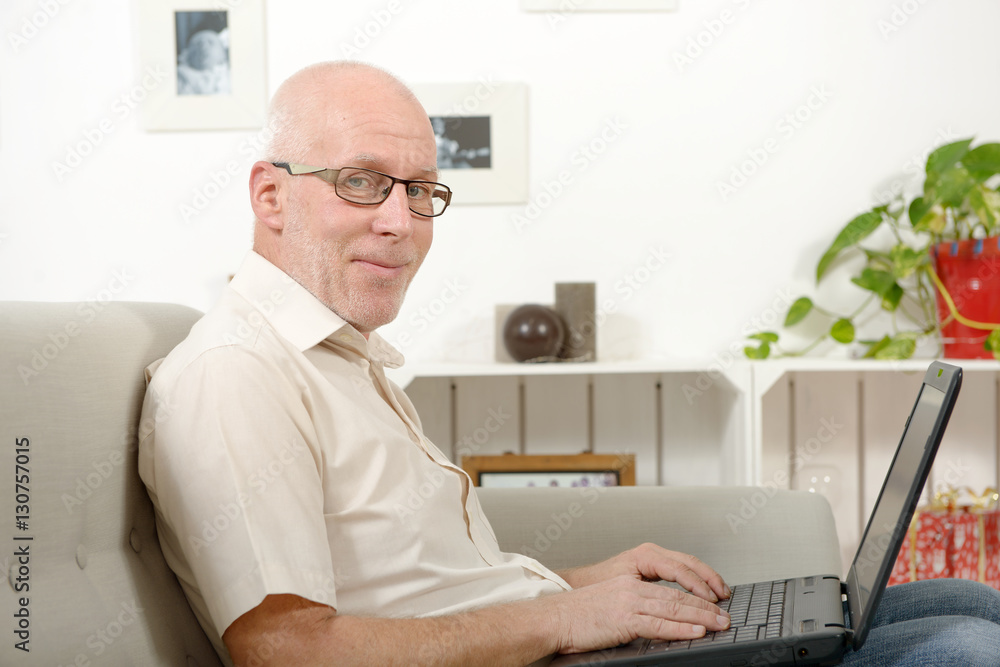 Portrait of a handsome mature man using laptop Portrait of a handsome mature man using laptop