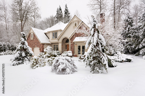 Suburan home, snowbound after a winter storm photo