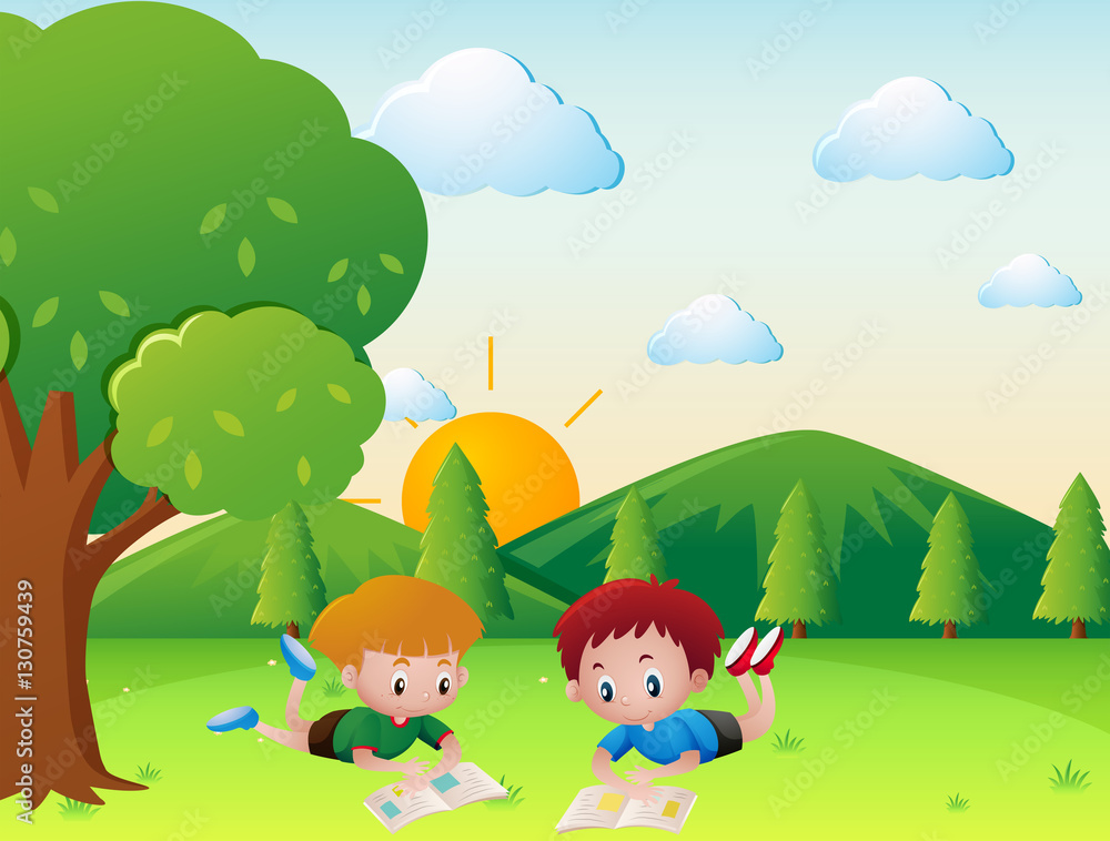 Two boys reading book in the park Two boys reading book in the park