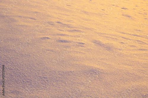 Snow Surface Texture with Golden Glitter and Lights.