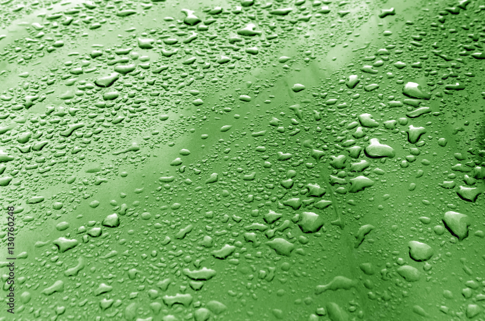 Rain drops on green metal surface. Rain drops on green metal surface.