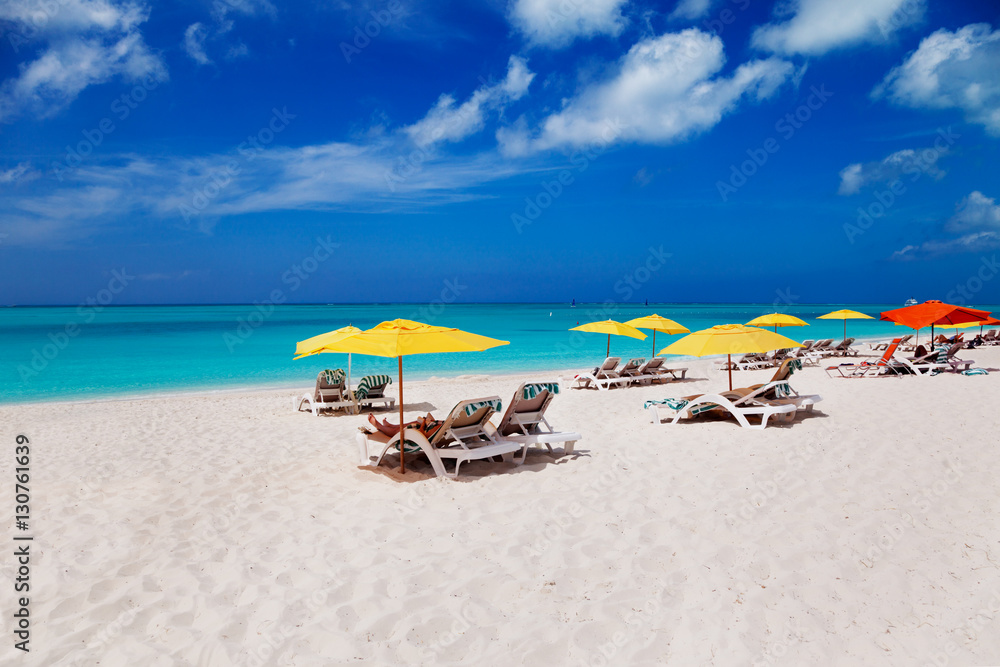 Lounge chairs and beach umbrellas on Grace Bay Beach