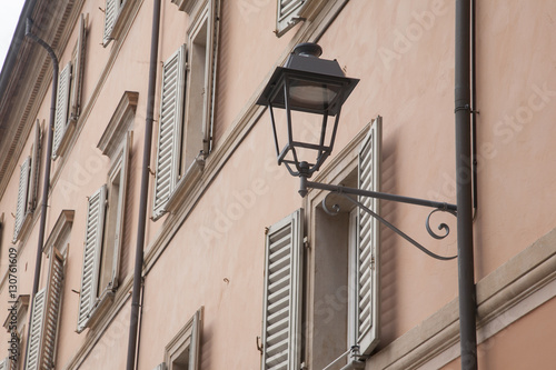 Lamppost on Facade in Bologna