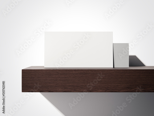 Stack of white business cards on a shelf. 3d rendering