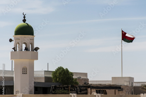Mosque tower ubar Dhofar mountain region Oman flag salalah 2 photo