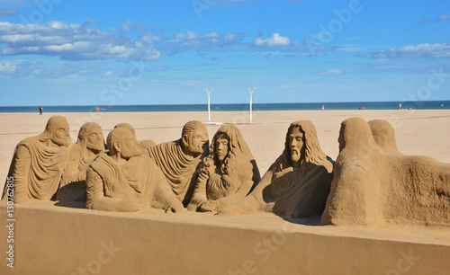 Beautiful large sand sculpture on Malvarrosa beach in Valencia, Spain