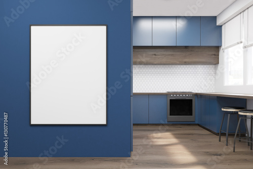 Blue kitchen with poster