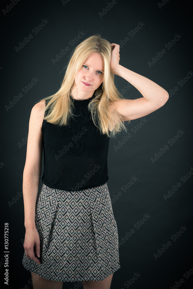 Beautiful woman doing different expressions in different sets of clothes: headache Beautiful woman doing different expressions in different sets of clothes: headache