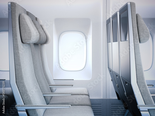 Gray airplane seats in the cabin. 3d rendering