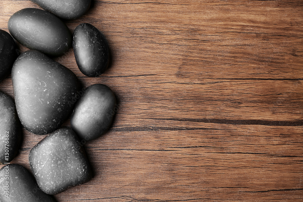 Spa stones on wooden background, top view Spa stones on wooden background, top view