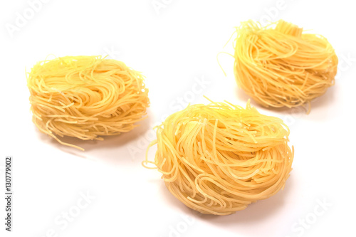 Vermicelli pasta nests isolated on white