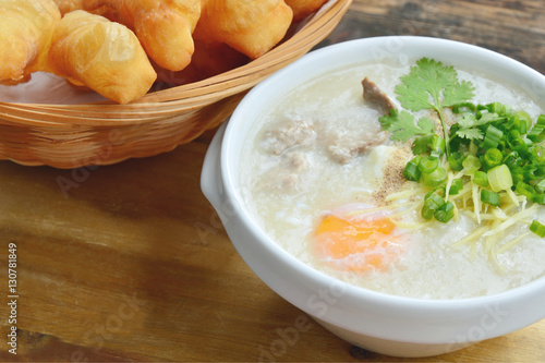 Pork congee with deep-fried dough stick. Rice porridge with liver,minced pork,egg and deep - fried dough stick . 