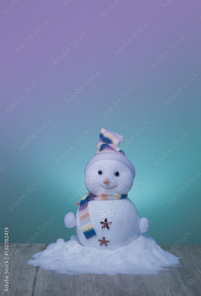 nice snowmen on wooden and green background nice snowmen on wooden and green background