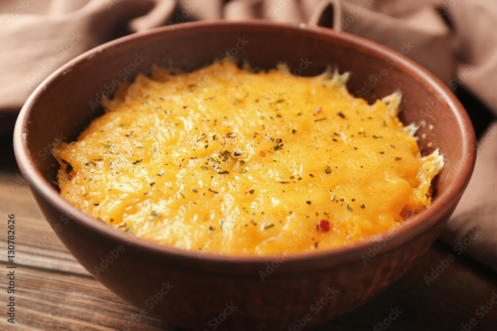 Corn porridge in plate and napkin on wooden background, closeup Corn porridge in plate and napkin on wooden background, closeup