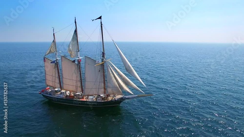 Tall ship at sea, majestic vessel sailing in open waters in good weather.
