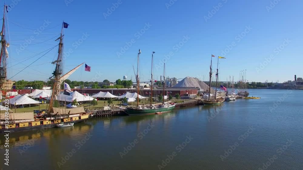 Several tall ships, majestic vessels moored along shore together.
Several tall ships, majestic vessels moored along shore together.