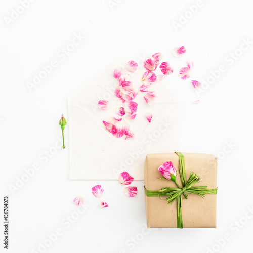 Flowers, paper cards and gift. Flat lay, Top view