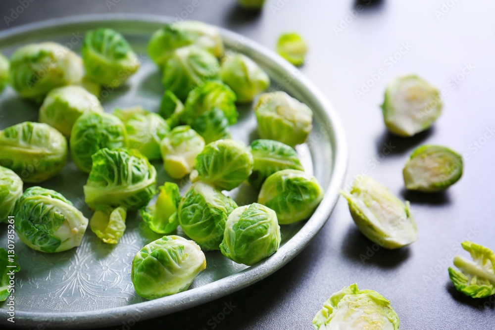 Metal tray with brussels sprouts on table Metal tray with brussels sprouts on table