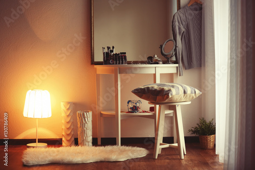 Cosmetics on table in room ...