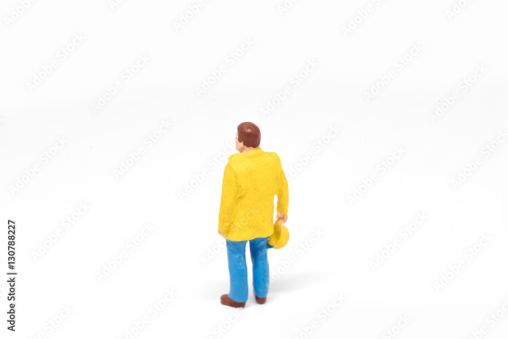 Miniature people worker safety construction concept on white background