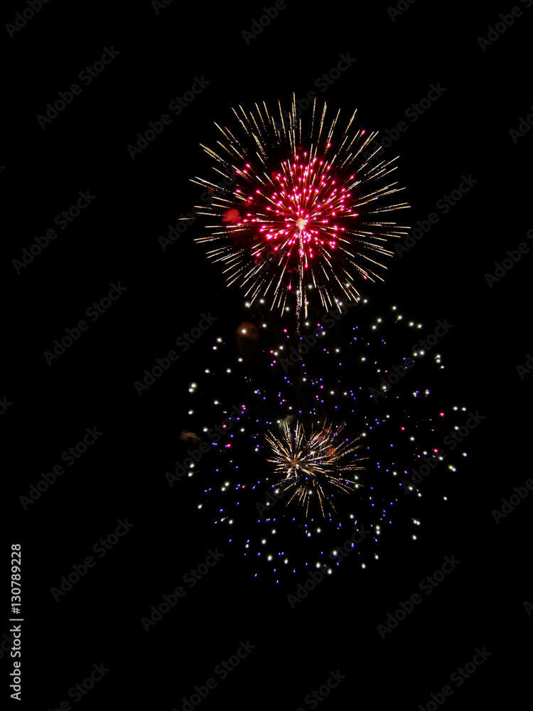 Brightly Colorful Fireworks isolated black background. New Year celebration fireworks.