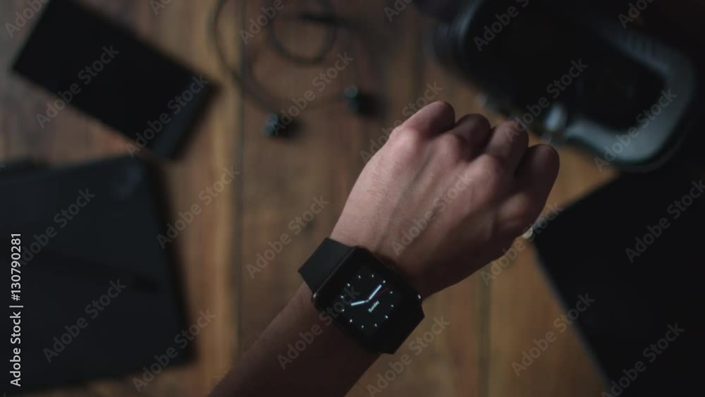 4k Technology Background of Businessman Turning on his Smartwatch 4k Technology Background of Businessman Turning on his Smartwatch
