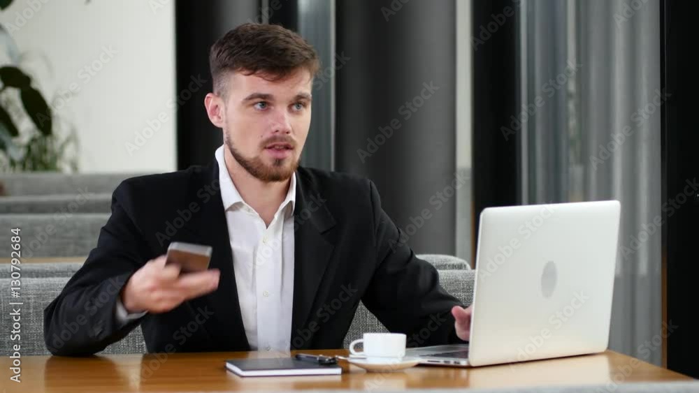 Office worker to make calls at a table in a cafe Office worker to make calls at a table in a cafe