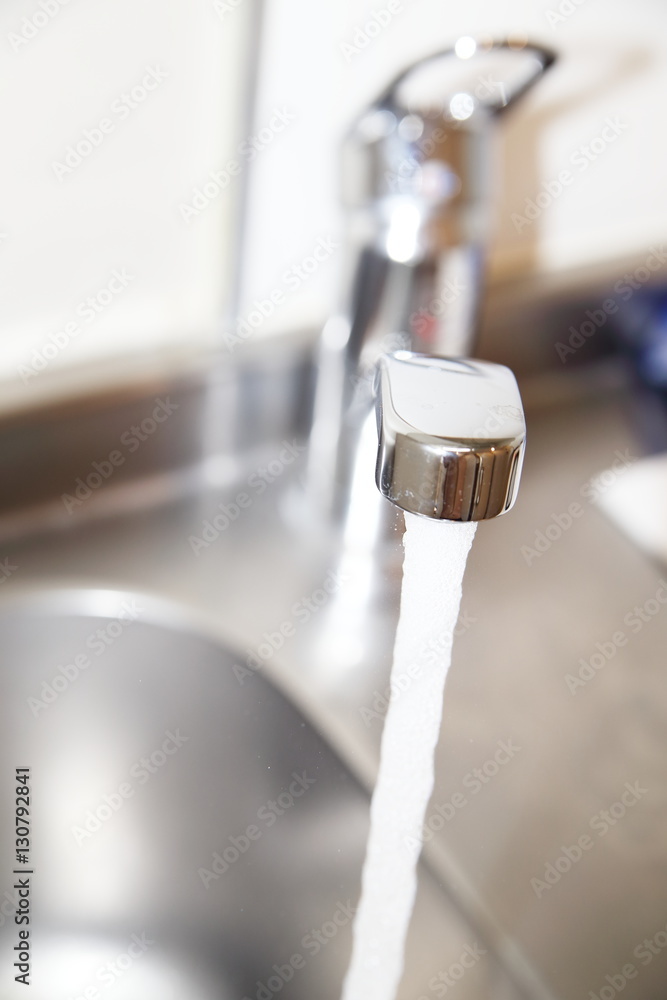 water flows from the kitchen faucet to sink water flows from the kitchen faucet to sink