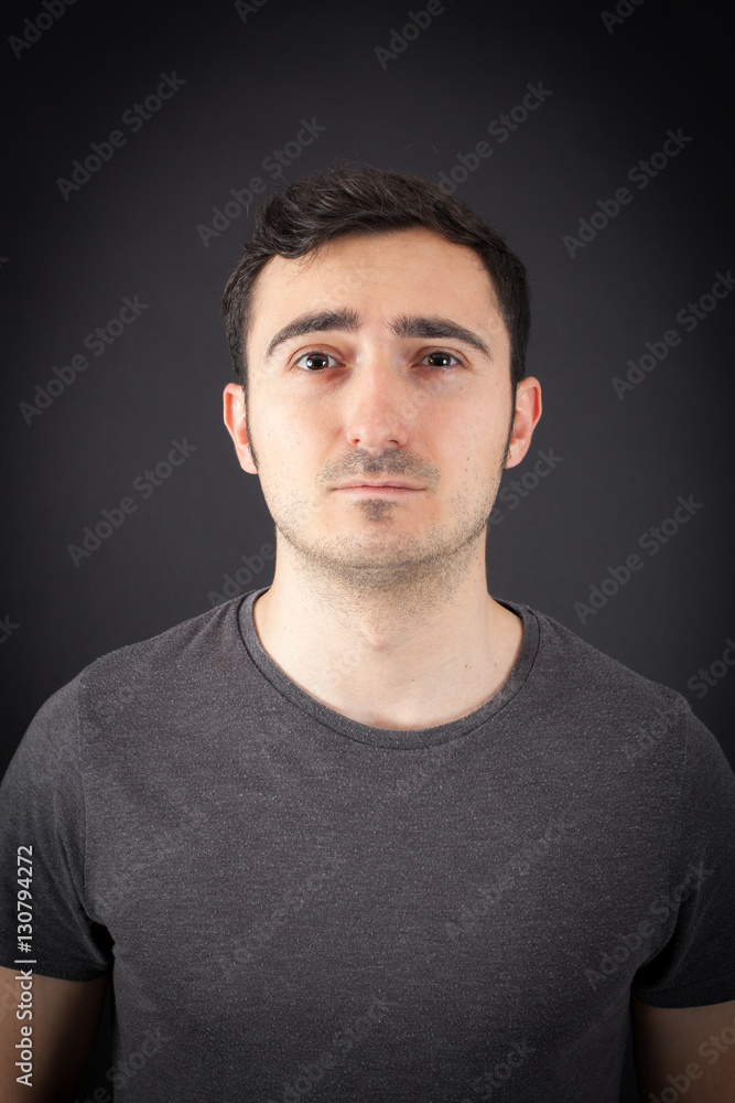 Fototapeta premium Handsome Man doing different expressions in different sets of clothes: sad