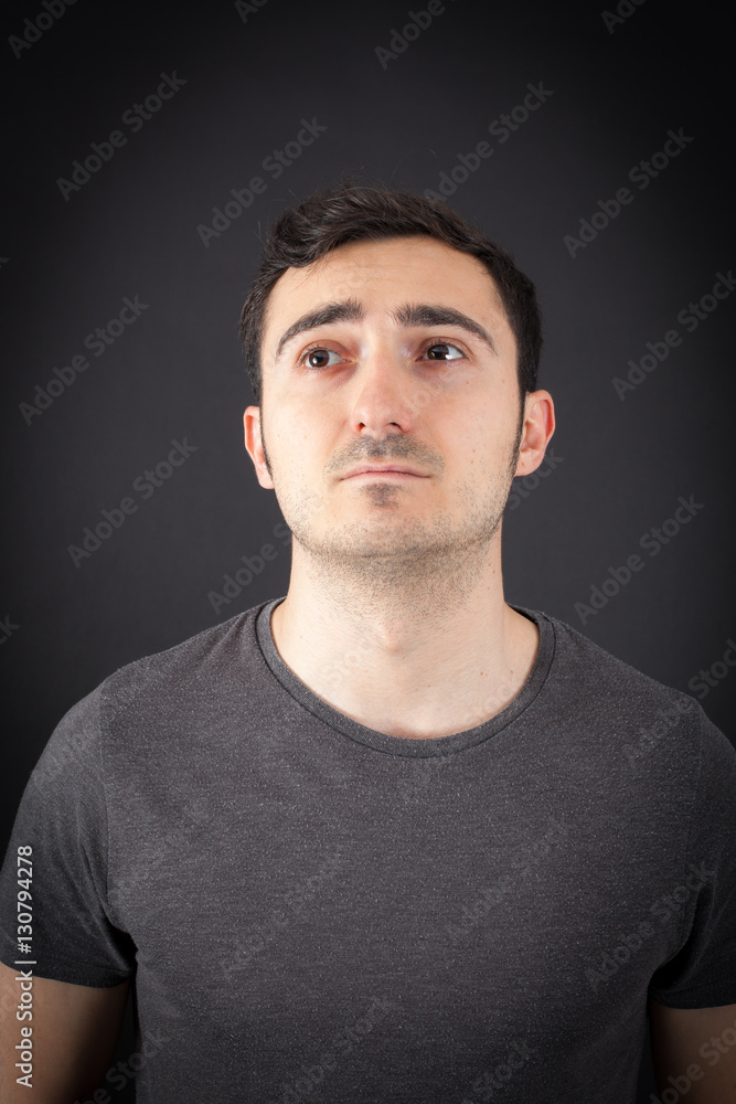 Fototapeta premium Handsome Man doing different expressions in different sets of clothes: thinking