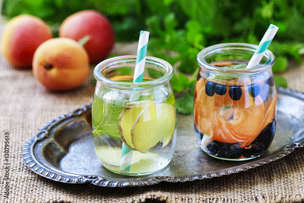 Healthy water with cucumber, zingiber, peach and mint. Healthy water with cucumber, zingiber, peach and mint.