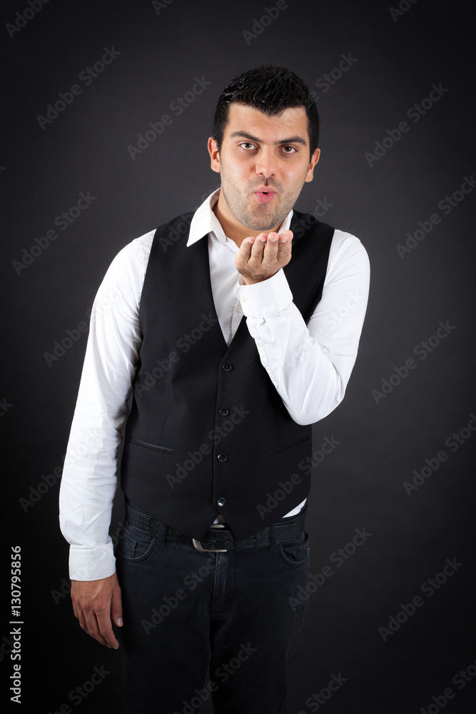 Handsome man doing different expressions in different sets of clothes: kiss Handsome man doing different expressions in different sets of clothes: kiss
