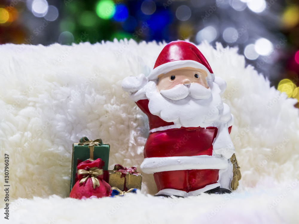 Santa sitting in front of Christmas tree waiting for Christmas Santa sitting in front of Christmas tree waiting for Christmas