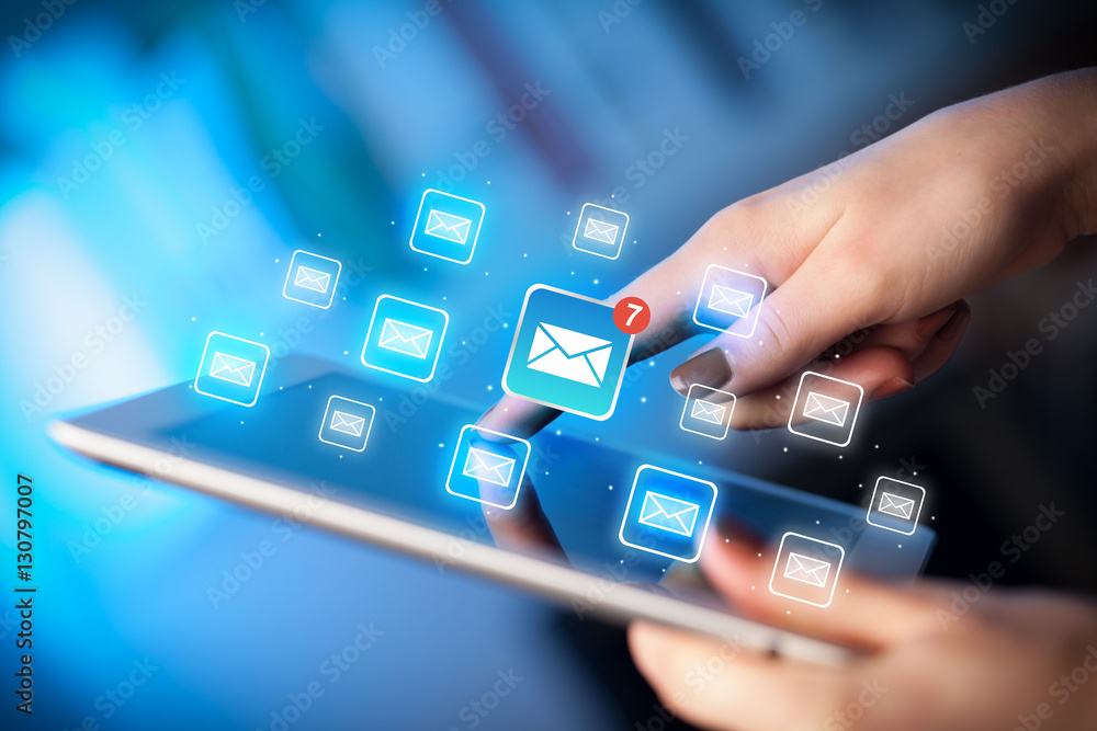 Fingers touching tablet with mail Fingers touching tablet with mail